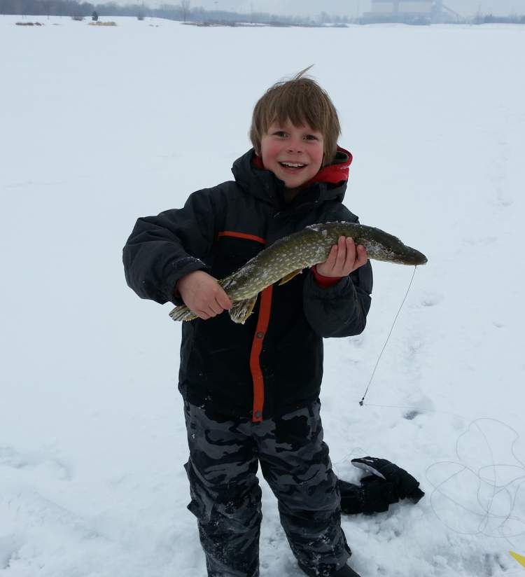 A kid ice fishing
