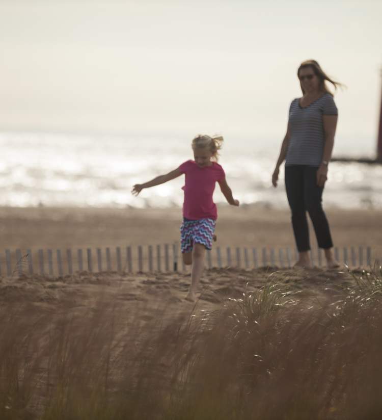 Family Walking at Simmons Island Beach