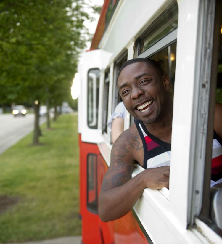 Man in the Window of a streetcar