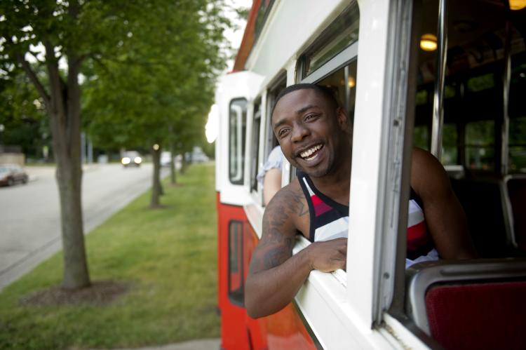 Man in the Window of a streetcar