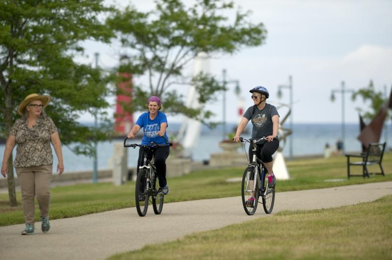 Biking on Pike Bike Trail along harbor