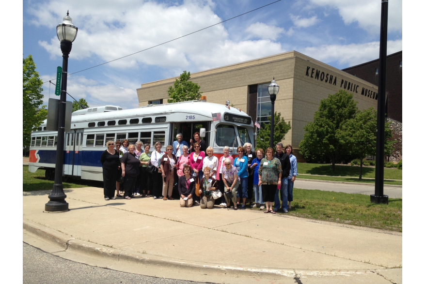 group posing outside Electric Streetcar