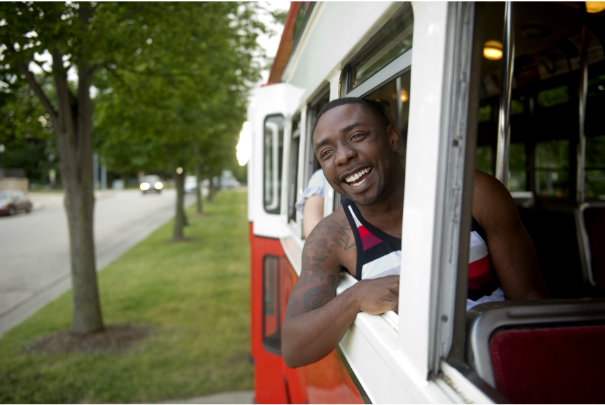 Man in the Window of a streetcar