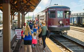 people standing at the boarding station of the Electric City Trolley Station & Museum in Scranton, PA