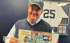 Brian Baumgartner (aka Kevin from The Office tv show) holding The Office Self-Guided Tour map