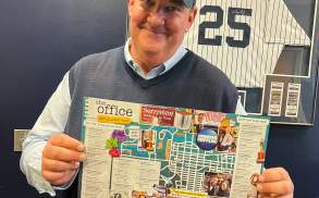 Brian Baumgartner (aka Kevin from The Office tv show) holding The Office Self-Guided Tour map