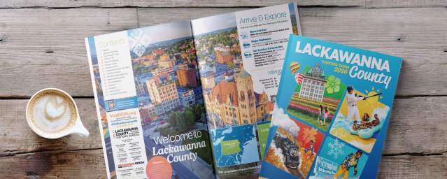 Front cover and open pages of the 2026 Lackawanna County Visitors Guide