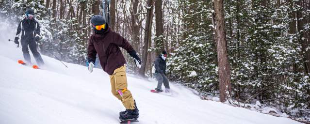 People snowboarding at Montage Mountain Ski Resort