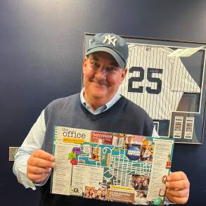 Brian Baumgartner (aka Kevin from The Office tv show) holding The Office Self-Guided Tour map