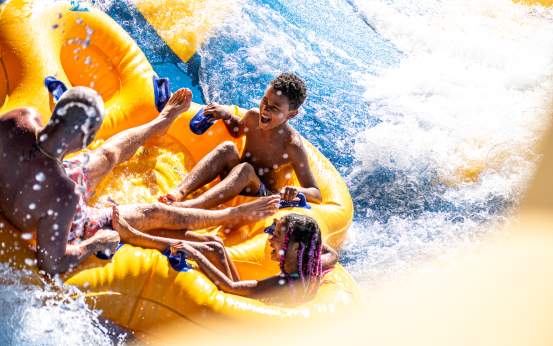 A family riding a tube down a waterslide at Montage Mountain Resorts in Scranton, PA