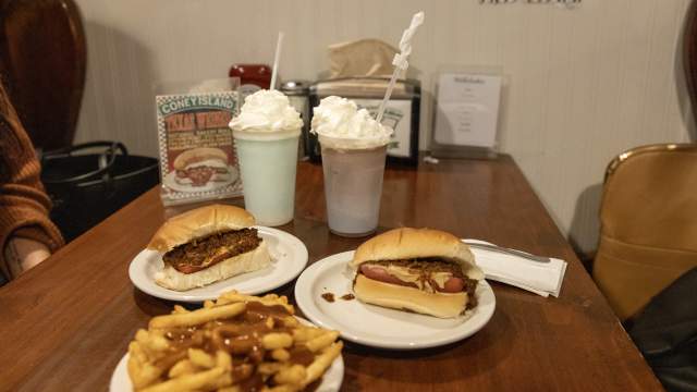 Table with french fries, two hot dogs and two milkshakes at Coney Island of Scranton