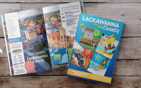 Front cover and open pages of the 2026 Lackawanna County Visitors Guide