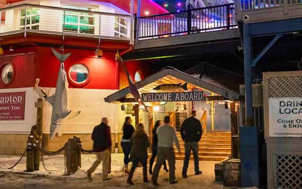 People walking into Cooper's Seafood House as part of The Office After Dark Tour by NEPA Tour Co.
