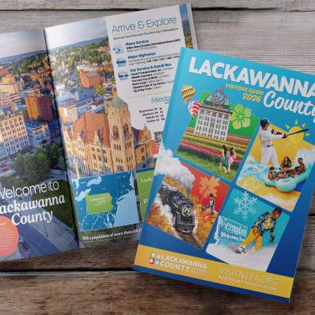 Front cover and open pages of the 2026 Lackawanna County Visitors Guide