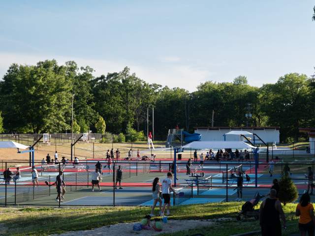 People playing at the pickleball and basketball courts at Nay Aug Park in Scranton, PA