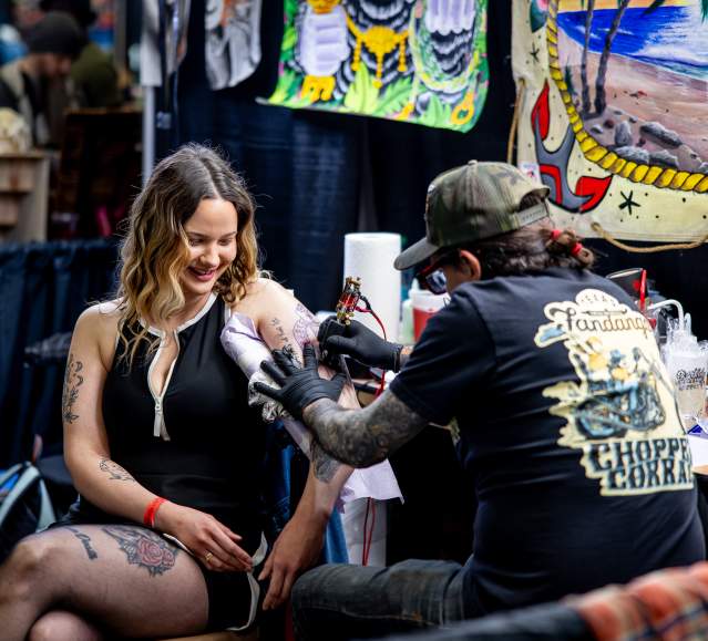 A woman getting tattooed at the Electric City Tattoo Convention at the Hilton Scranton & Conference Center in Downtown Scranton, PA