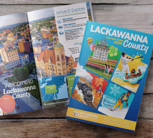 Front cover and open pages of the 2026 Lackawanna County Visitors Guide