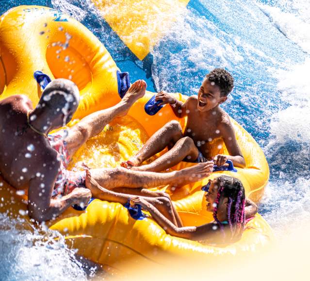 A family riding a tube down a waterslide at Montage Mountain Resorts in Scranton, PA