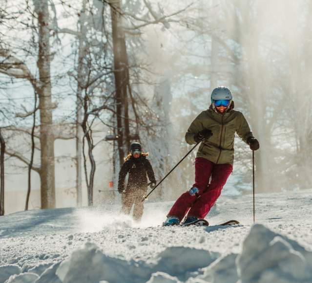 Two people skiing on the slopes of Montage Mountain Resorts in Scranton, PA