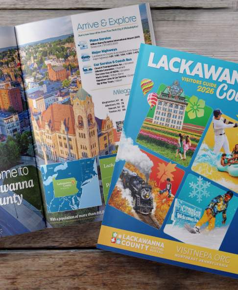 Front cover and open pages of the 2026 Lackawanna County Visitors Guide