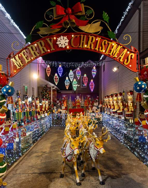 View at night with festive holiday lights illuminating the Christmas Lights House in Scranton, PA.