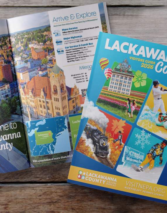 Front cover and open pages of the 2026 Lackawanna County Visitors Guide