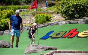 A family mini golfing at Lahey Family Fun Park in Clarks Summit, PA