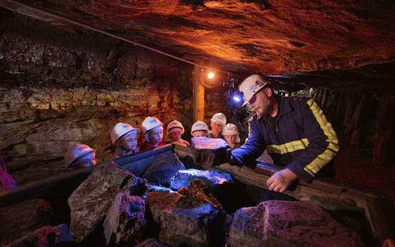 A group of kids on a tour at the Lackawanna Coal Mine Tour in McDade Park in Scranton, PA