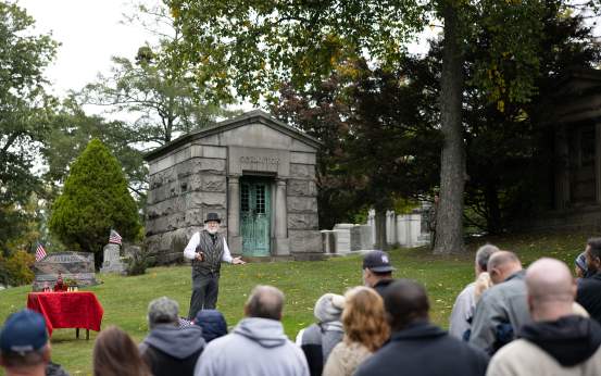Visitors watching a historical performance during the Dunmore Cemetery Tour