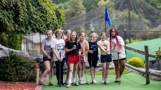 A group of kids posing for a picture at Lahey Family Fun Park's mini golf course in Clarks Summit, PA