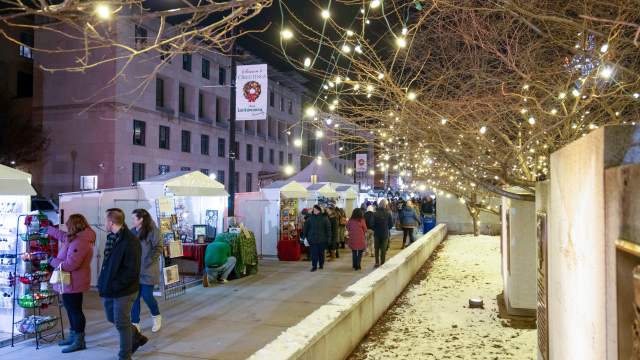 Holiday lights, shoppers, and vendors at the Lackawanna Winter Market in downtown Scranton, PA