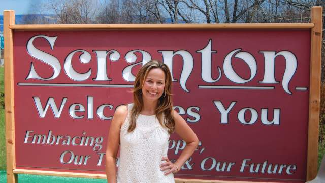 The Office - Janet Levinson (Melora Hardin) at Scranton Welcome Sign