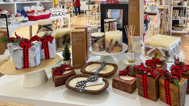 Candles and other merchandise with holiday decorations at Noteology in Scranton