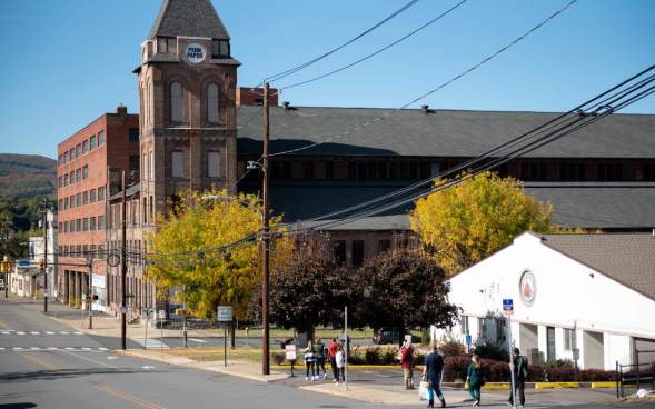People walking down the street toward Pennsylvania Paper & Supply Co. as part of The Office Guided Walking Tour by NEPA Tour Co.
