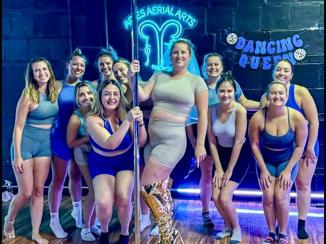 Women posing for a photo during a bachelorette party at Aries Aerial Arts & Pole Dance Fitness in Scranton, PA