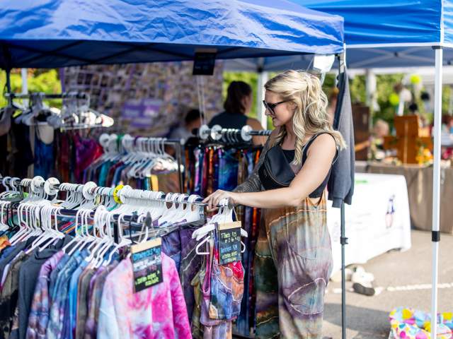 A lady shopping with local vendors at the Moscow Country Street Fair in Moscow, PA