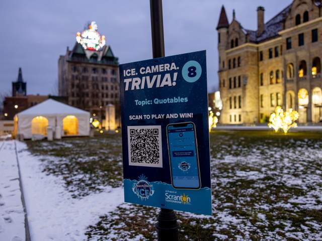 A poster with a QR Code for the Sculpture Scavenger Hunt at the Downtown on Ice festival in Downtown Scranton, PA