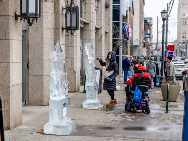 Woman viewing an ice sculpture at Downtown On Ice in Downtown Scranton, PA