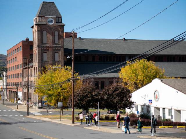 People walking down the street toward Pennsylvania Paper & Supply Co. as part of The Office Guided Walking Tour by NEPA Tour Co.