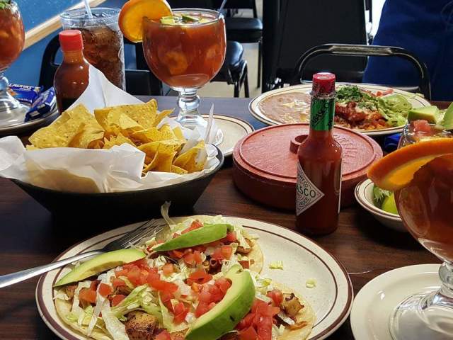 Table set with Mexican dishes and drinks at Garibaldi Mexican Restaurant in Scranton, PA