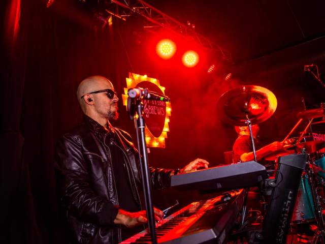 A keyboardist and a drummer performing on stage at the Rhythm & Brews festival at Montage Mountain Resorts in Scranton, PA