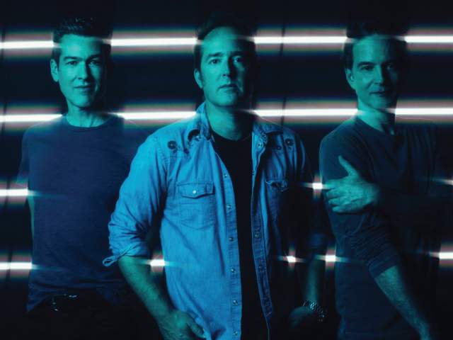 the band members of Tonic posing for a photo