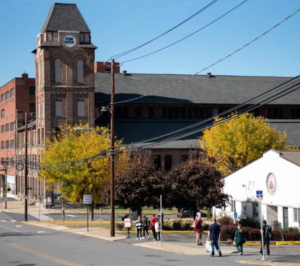 People walking down the street toward Pennsylvania Paper & Supply Co. as part of The Office Guided Walking Tour by NEPA Tour Co.