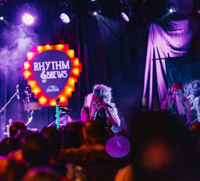A band performing on stage in front of a crowd at the Rhythm & Brews Rhythm & Brews festival at Montage Mountain Resorts in Scranton, PA
