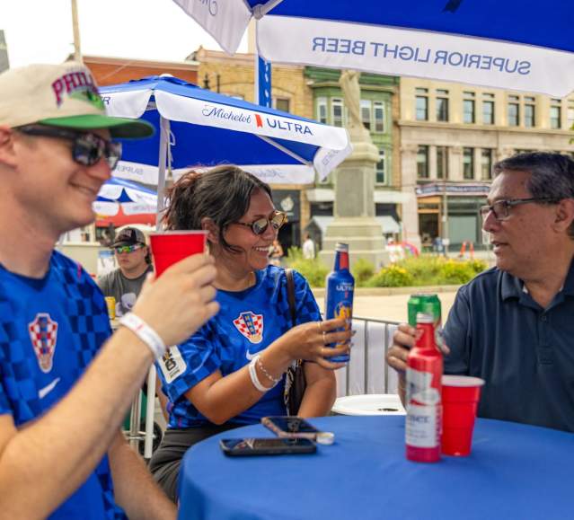 People enjoying drinks at the Michelob Ultra Beer Garden at the World Cup Fan Zone in Downtown Scranton, PA