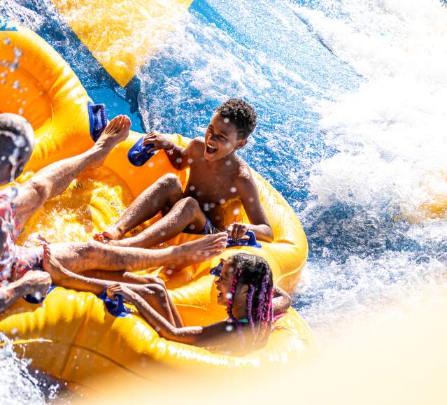 A family riding a tube down a waterslide at Montage Mountain Resorts in Scranton, PA