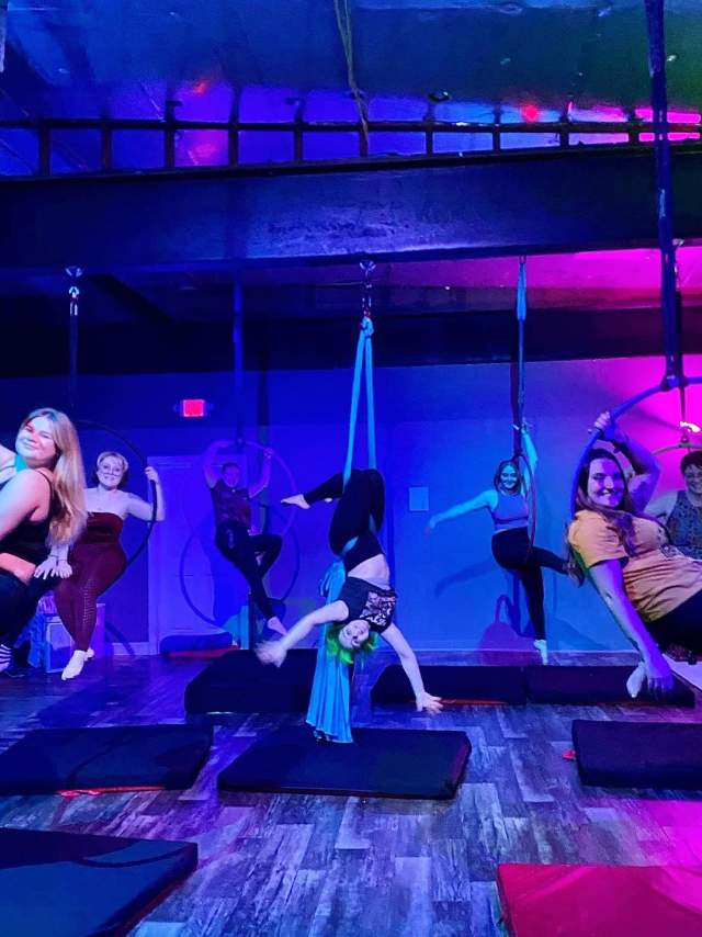 Women posing at a class at Aries Aerial Arts & Pole Dance Fitness in Scranton, PA