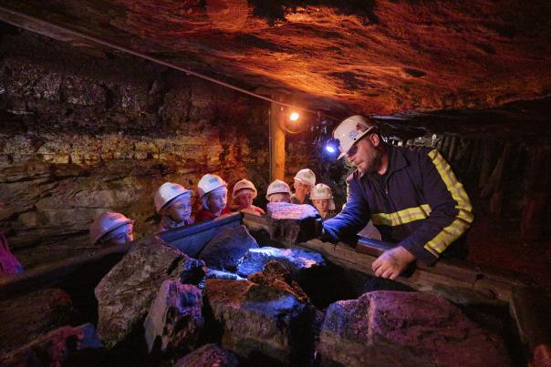 A group of kids on a tour at the Lackawanna Coal Mine Tour in McDade Park in Scranton, PA