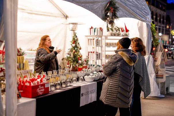 Women shopping at a vendor at the Lackawanna Winter Market in downtown Scranton, PA