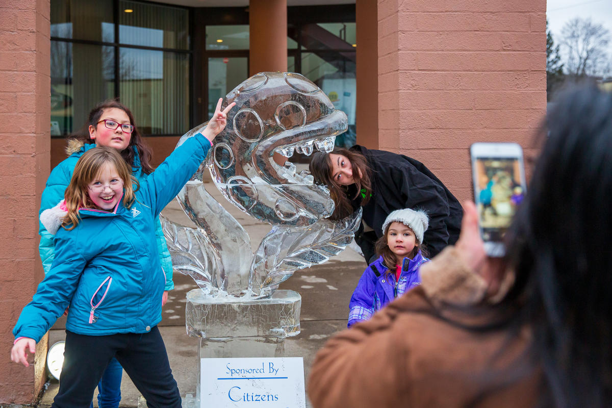 People posing for pics in front of sculptures at the Clarks Summit Festival of Ice